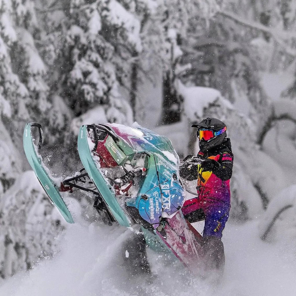 Lia Larsson riding her Galaxy Ski-Doo in deep powder