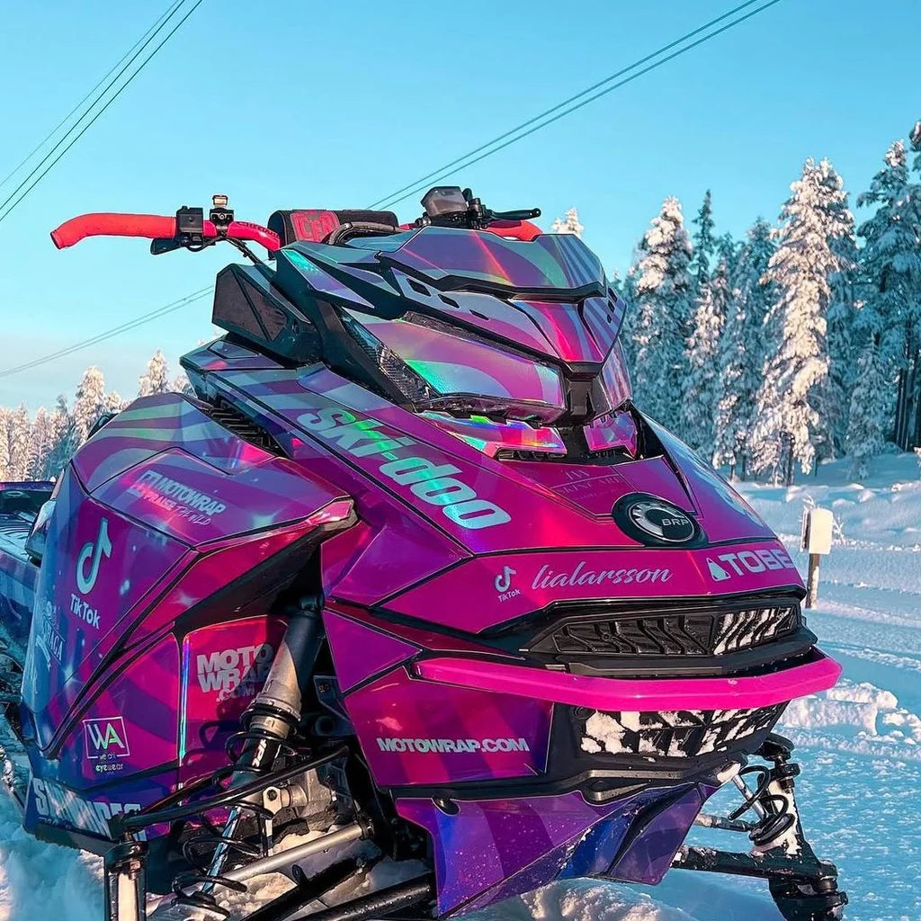 Lia Larsson's Pink Warp Ski-Doo in the snow